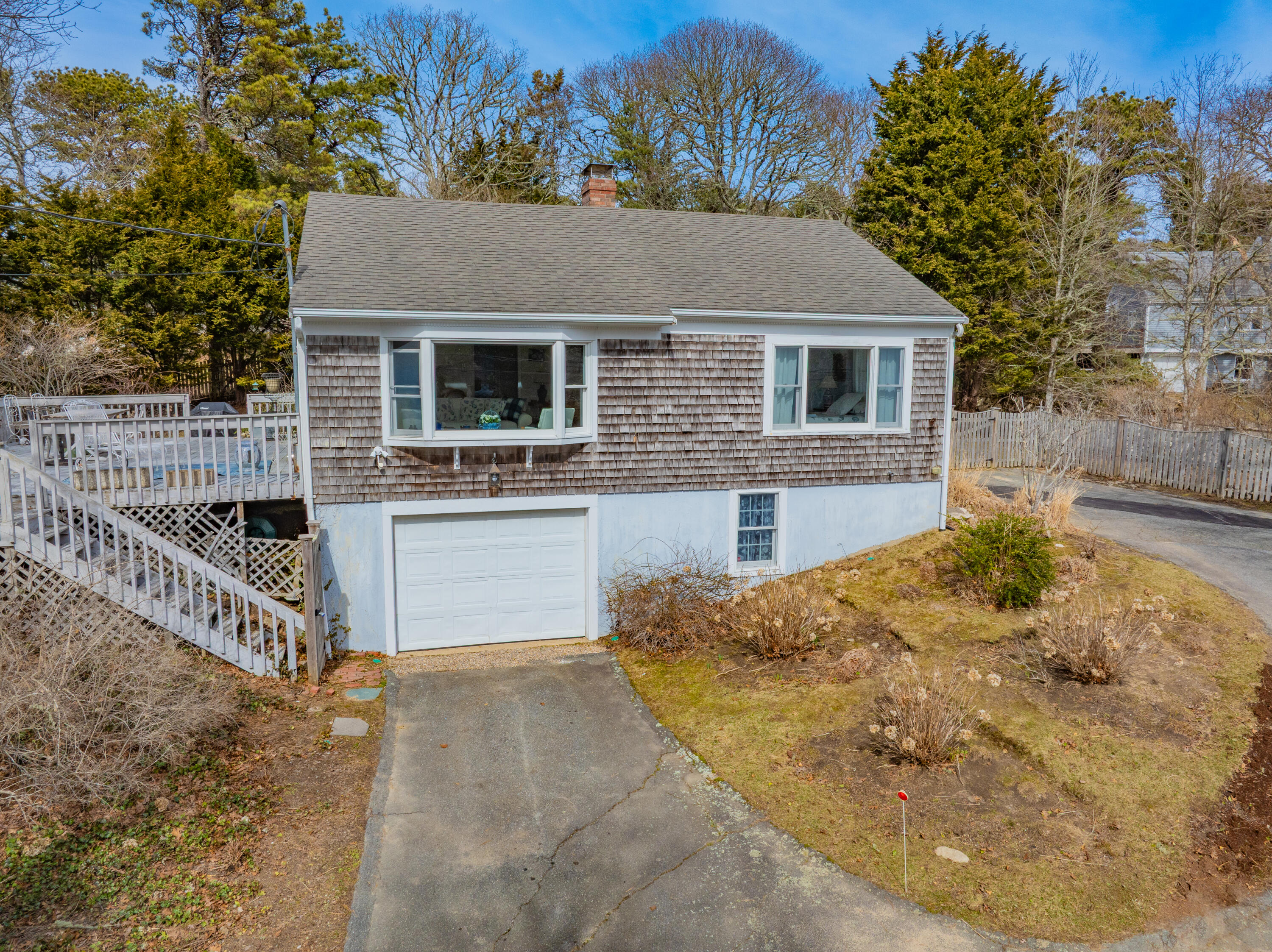 118 Wilfred Road Chatham, MA 02633 - Photo 39 of 49 a front view of house with yard and trees in the background
