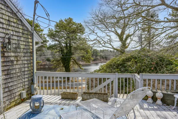 a view of a balcony with wooden floor
