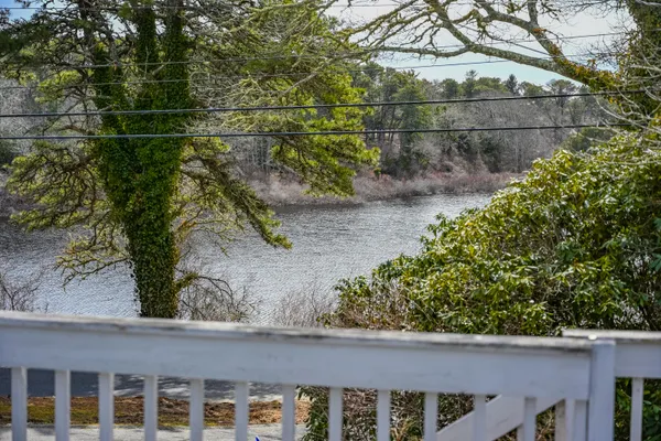 a view of a wooden fence and a yard
