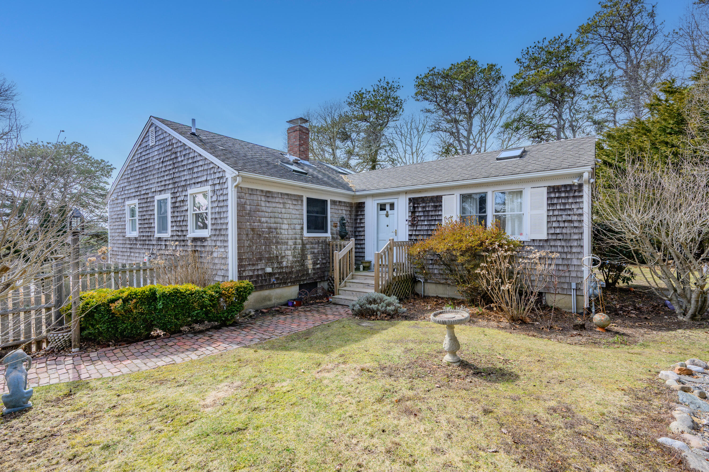 118 Wilfred Road Chatham, MA 02633 - Photo 4 of 49 a view of a house with a small yard and plants