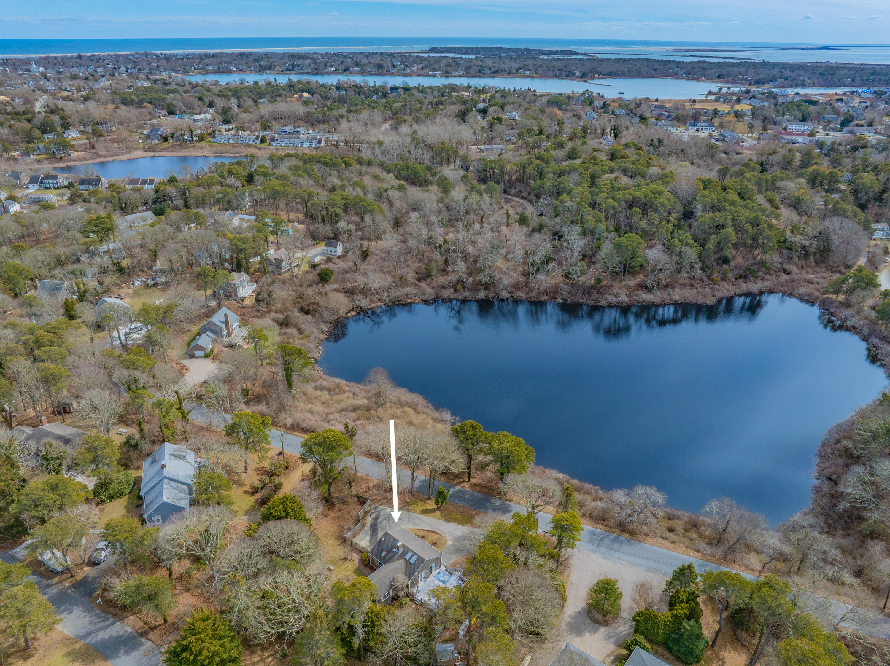 118 Wilfred Road Chatham, MA 02633 - Photo 46 of 49 a view of a lake with a mountain in the background