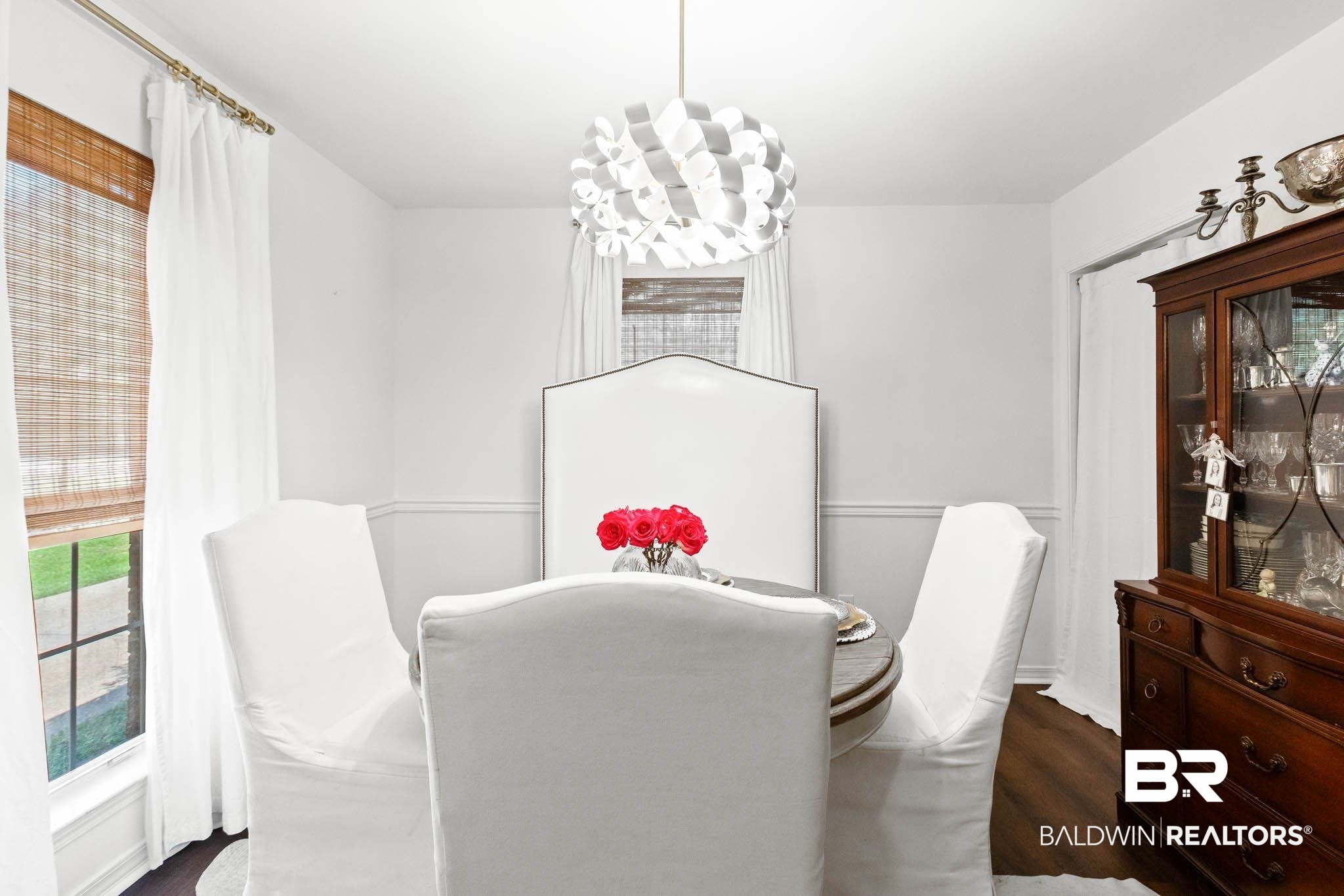20685 Lowry Drive Fairhope, AL 36532 - Photo 22 of 48 Dining space featuring dark wood-type flooring and a chandelier