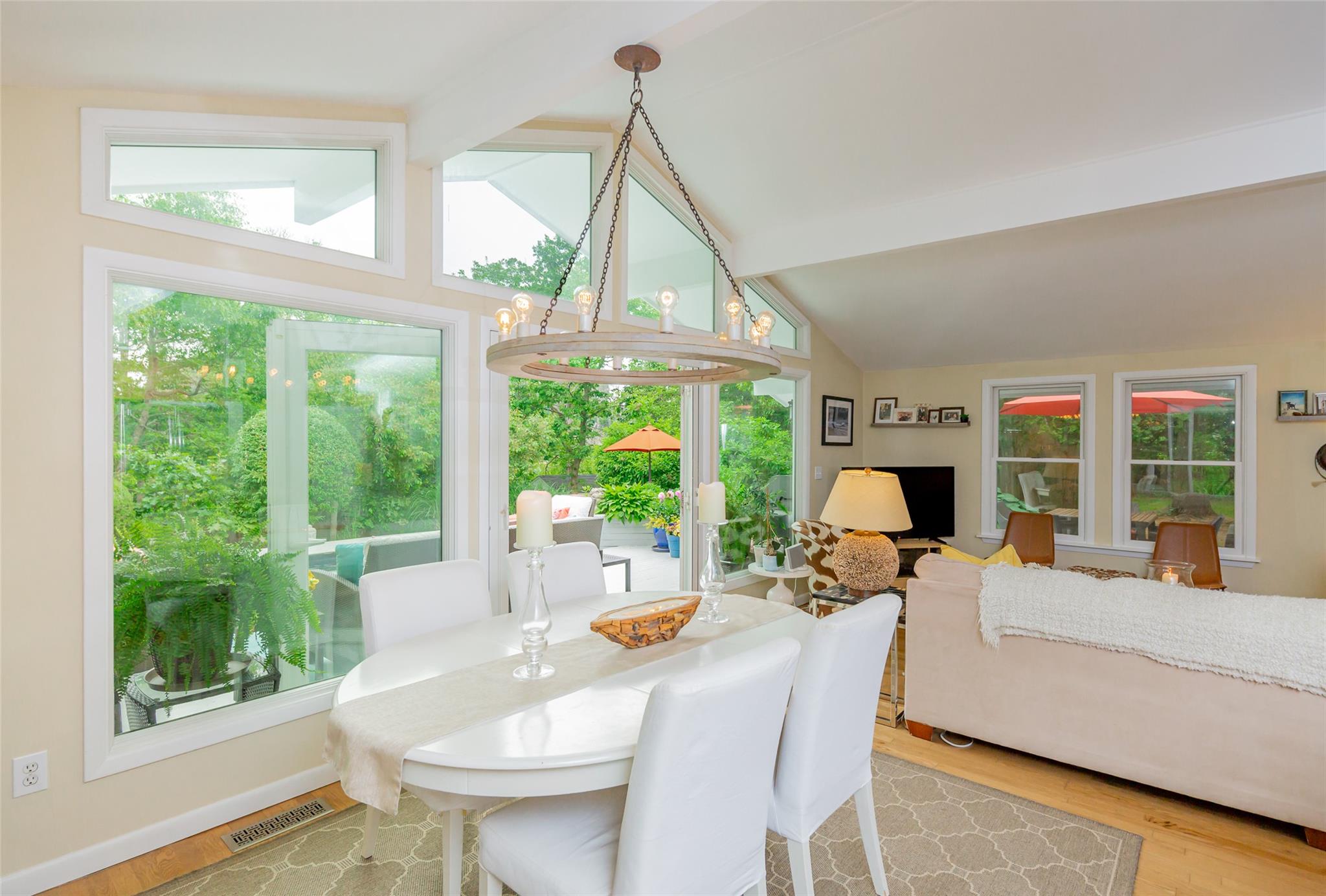 21 Hillover Road East Hampton Bays, NY 11946 - Photo 14 of 33 a living room with furniture a fireplace and a large window