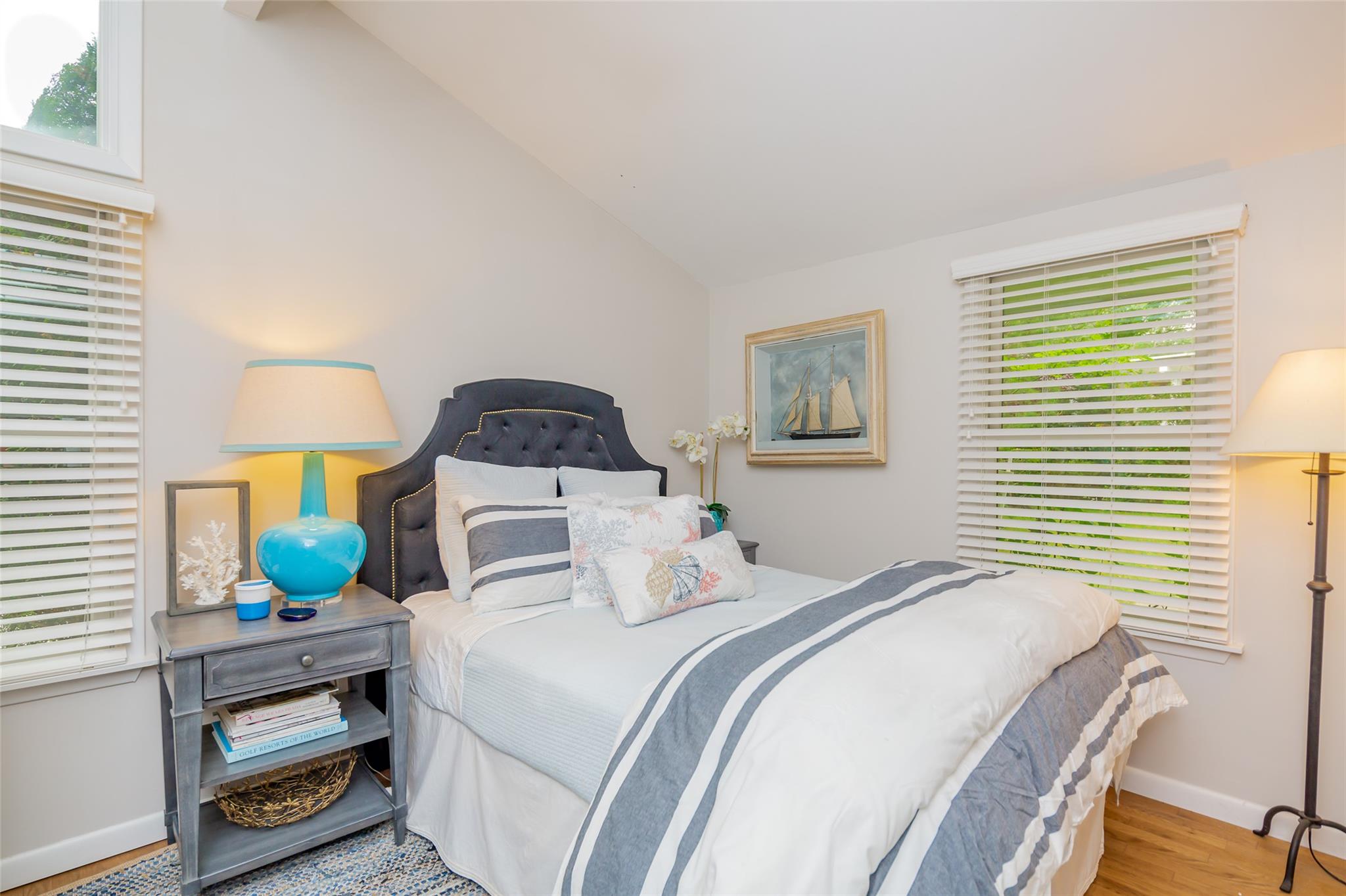 21 Hillover Road East Hampton Bays, NY 11946 - Photo 18 of 33 a bedroom with a bed a window and dresser
