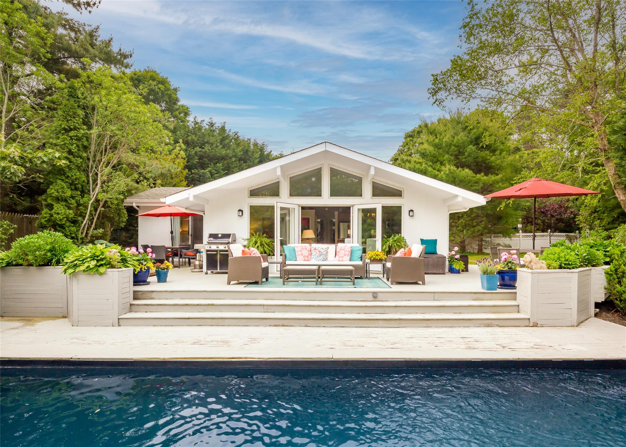 21 Hillover Road East Hampton Bays, NY 11946 - Photo 2 of 33 a front view of a house with sitting area