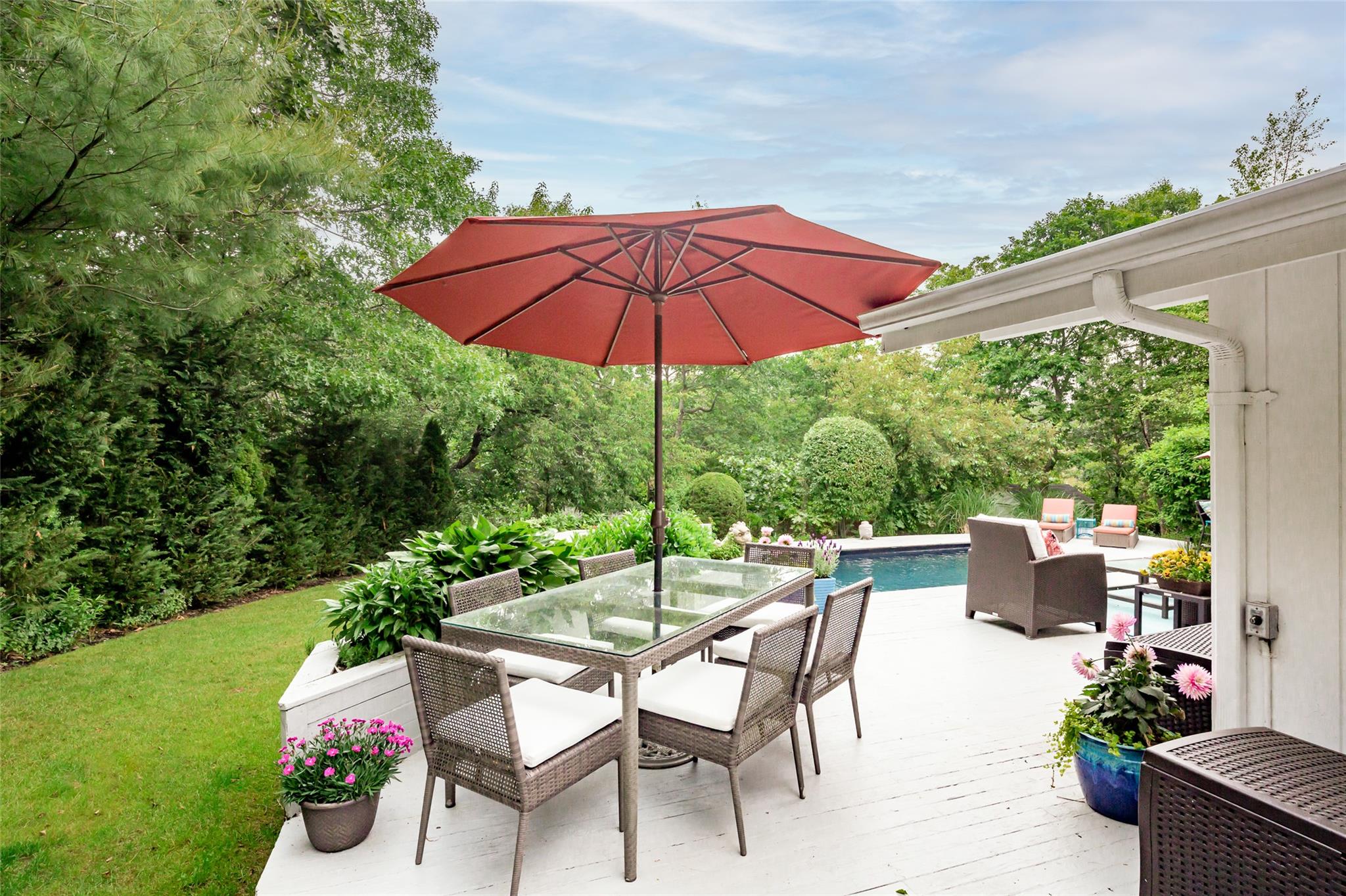 21 Hillover Road East Hampton Bays, NY 11946 - Photo 21 of 33 an outdoor space with furniture and umbrella