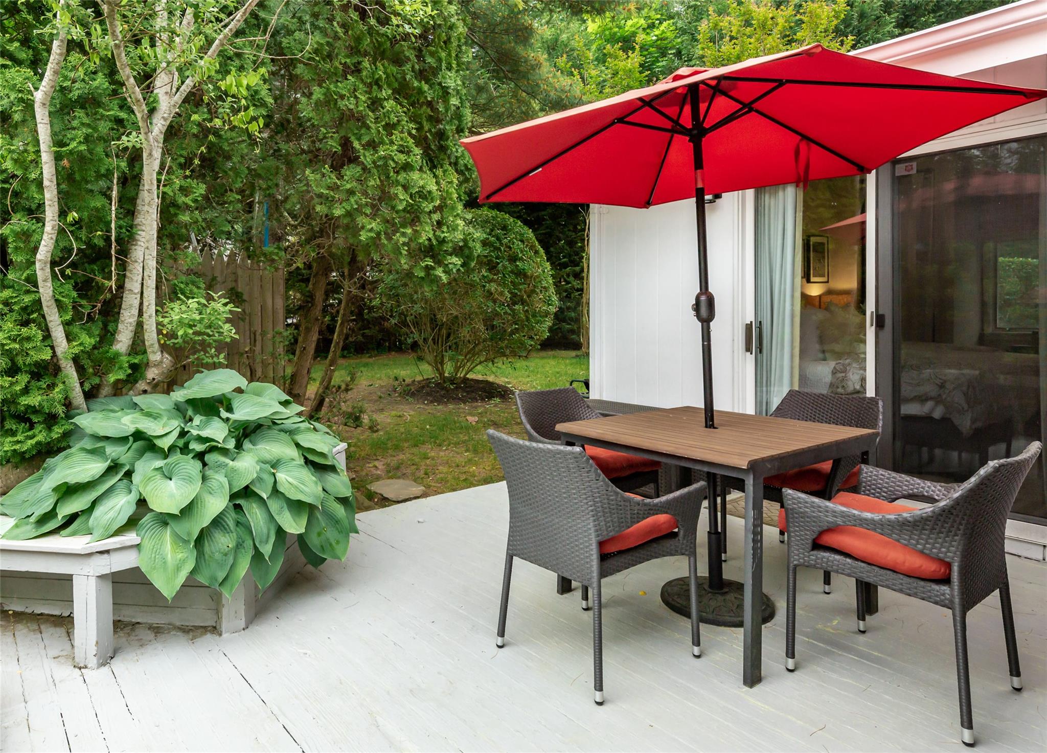 21 Hillover Road East Hampton Bays, NY 11946 - Photo 27 of 33 a view of a house with backyard sitting area and sitting area