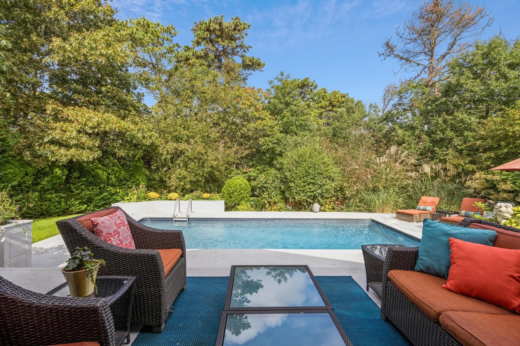 21 Hillover Road East Hampton Bays, NY 11946 - Photo 3 of 33 a view of a chairs in a patio