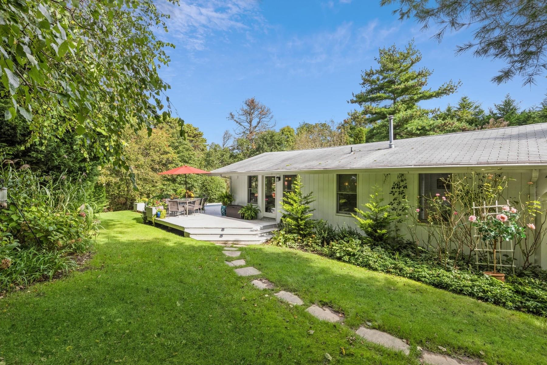 21 Hillover Road East Hampton Bays, NY 11946 - Photo 5 of 33 a front view of a house with garden