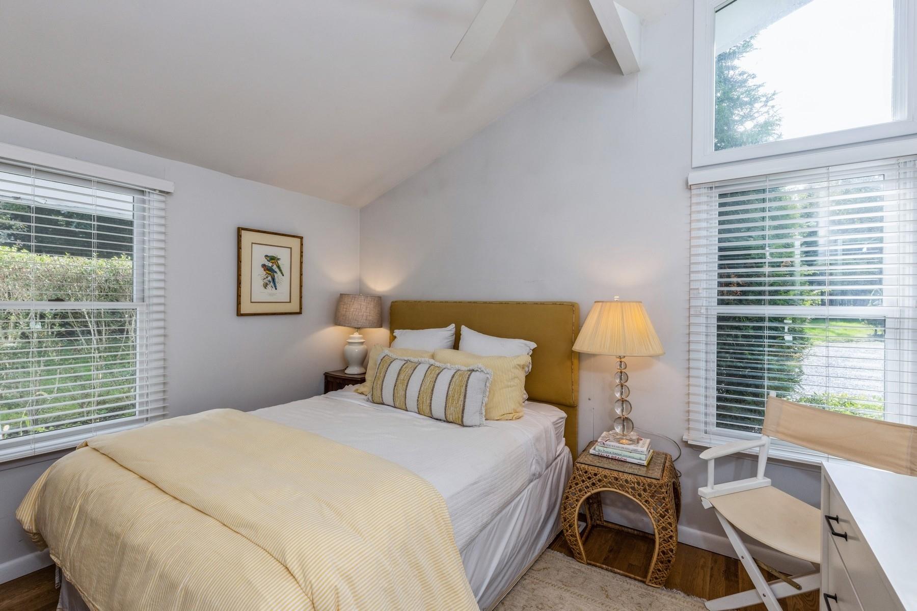 21 Hillover Road East Hampton Bays, NY 11946 - Photo 6 of 33 a bedroom with a bed and a window