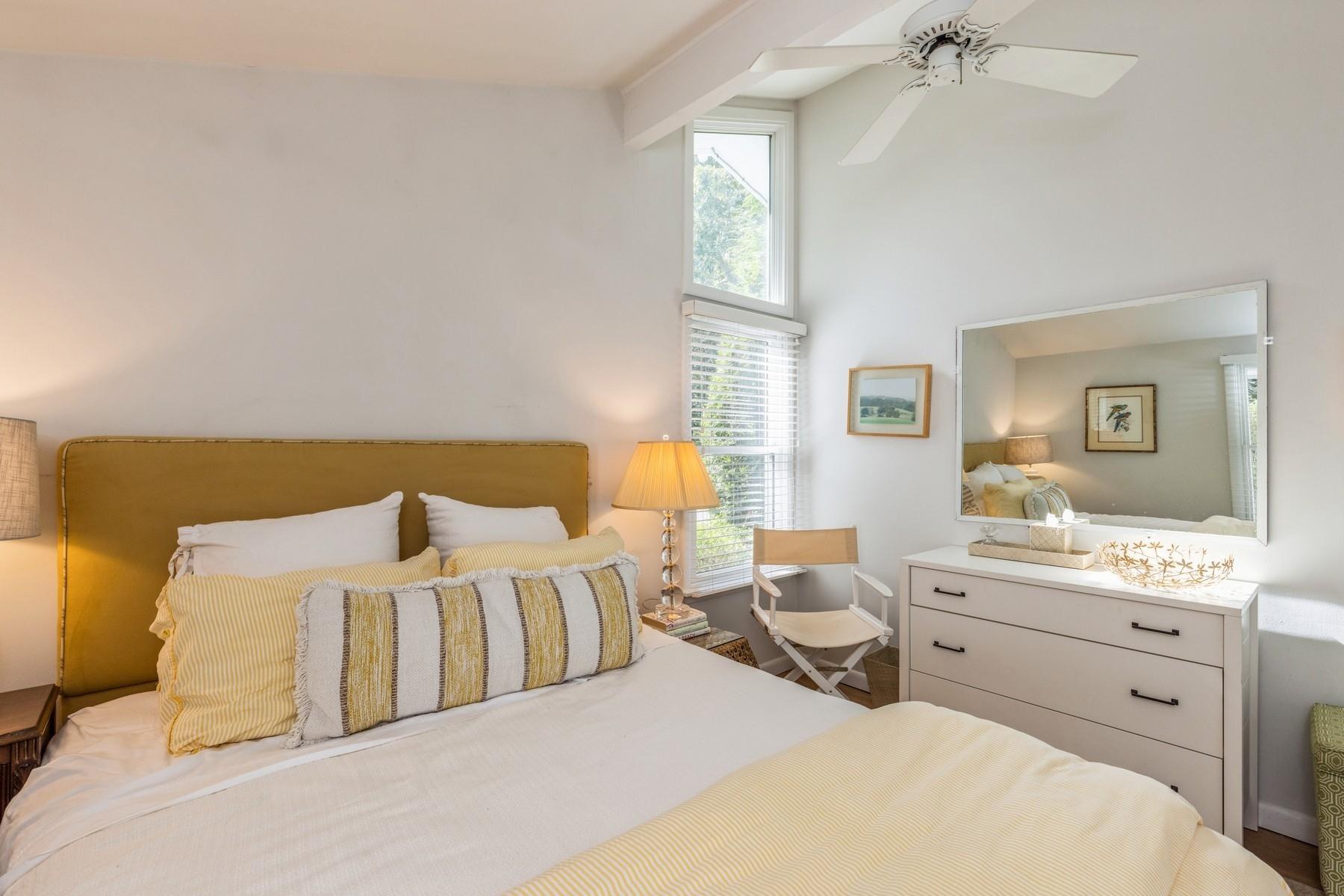 21 Hillover Road East Hampton Bays, NY 11946 - Photo 7 of 33 a bedroom with a bed and dresser