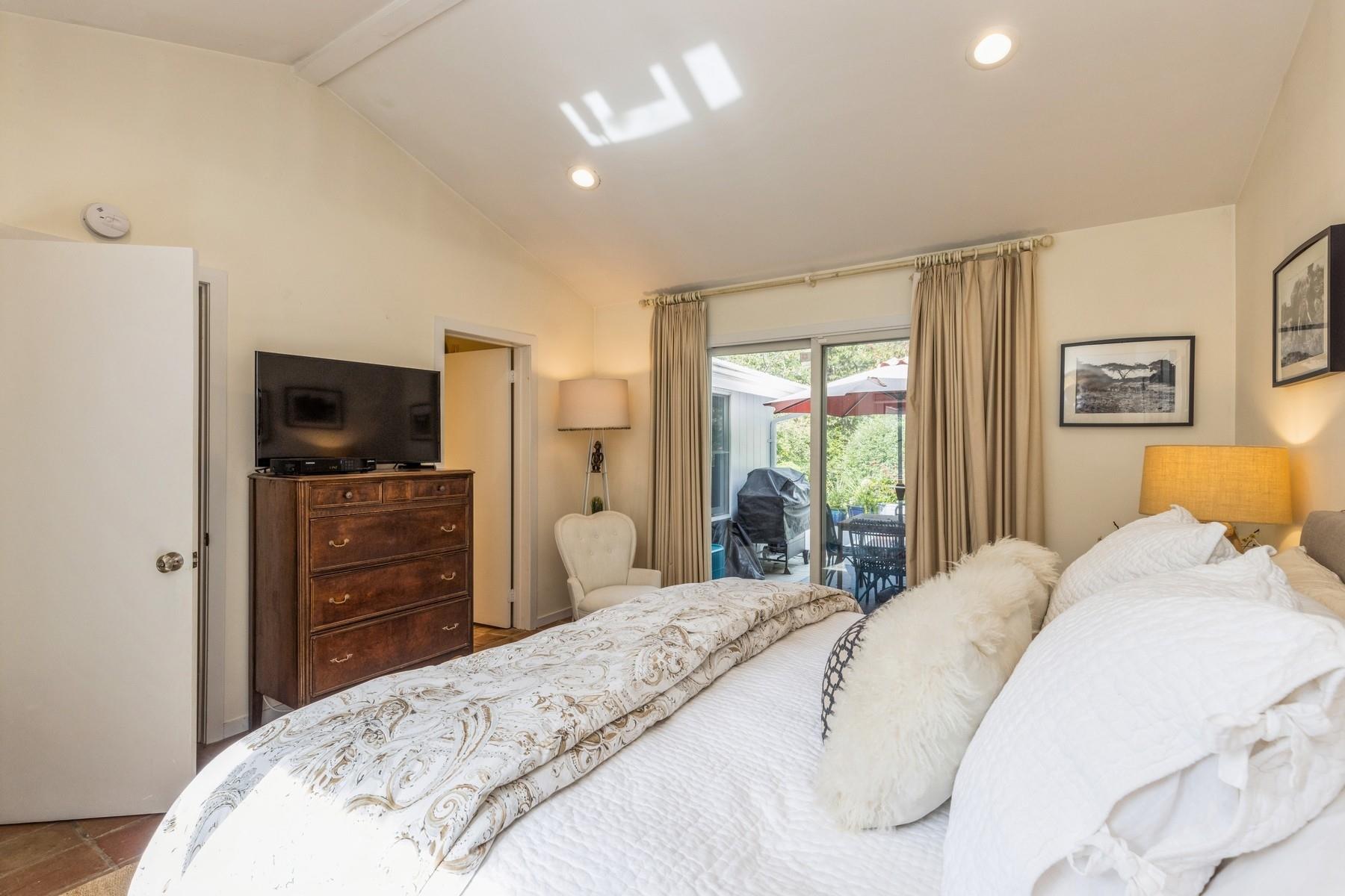 21 Hillover Road East Hampton Bays, NY 11946 - Photo 10 of 33 a bedroom with a bed and a dresser