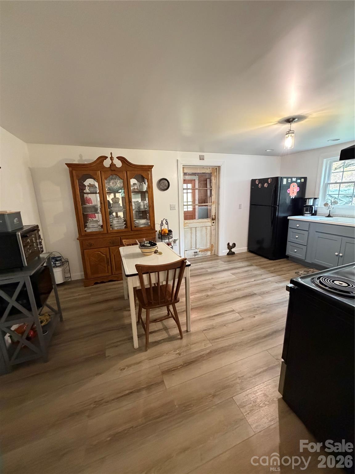 658 Upper Hanging Rock Road Spruce Pine, NC 28777 - Photo 11 of 35 a living room with furniture a piano and a flat screen tv