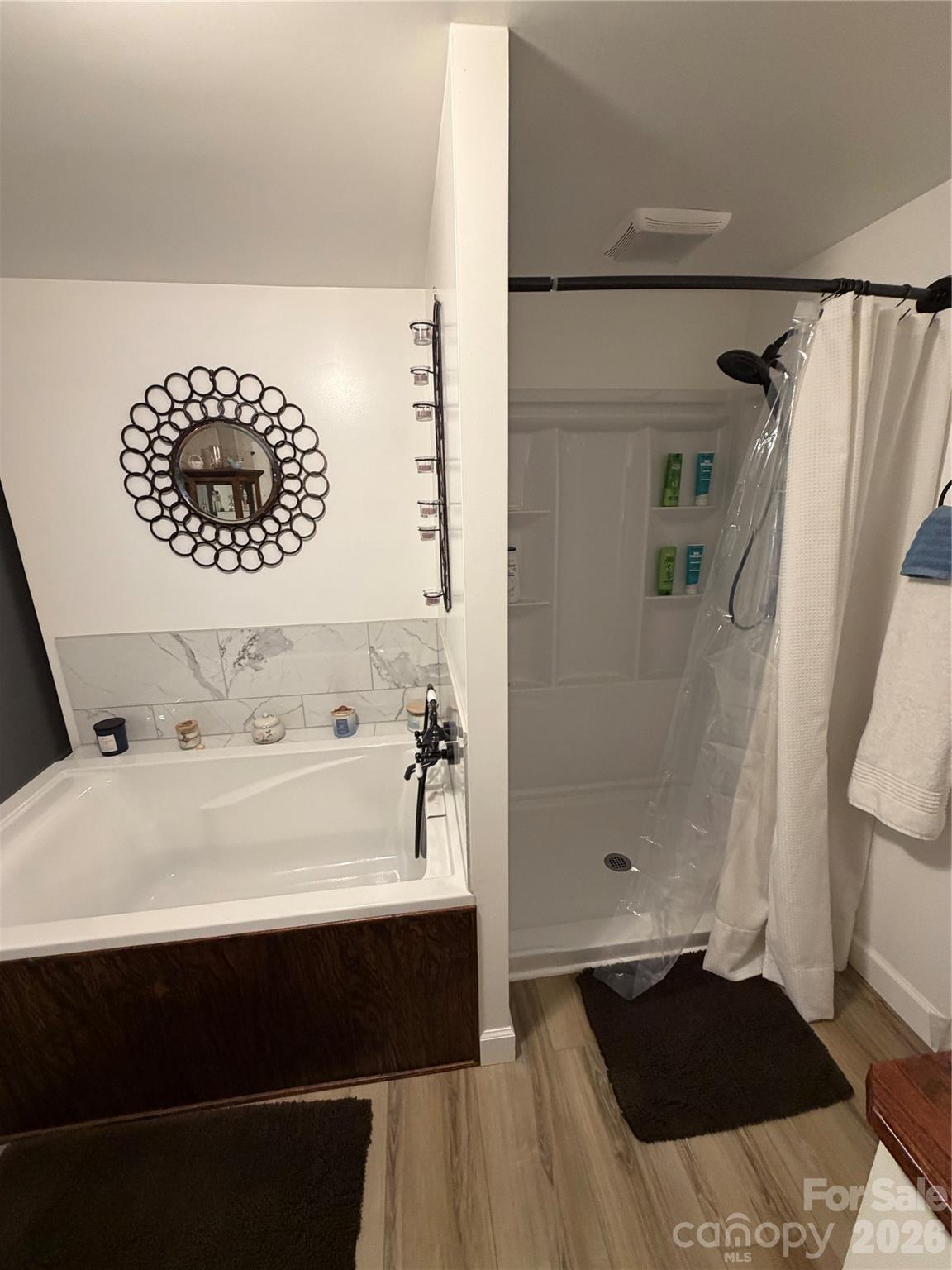658 Upper Hanging Rock Road Spruce Pine, NC 28777 - Photo 13 of 35 a bathroom with a bathtub and a shower