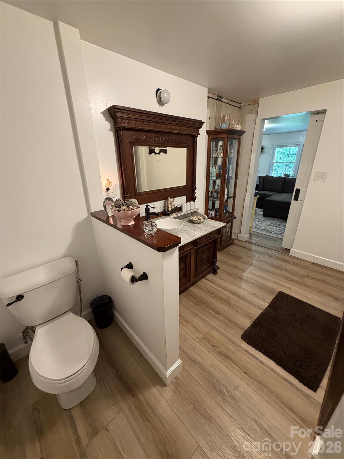 658 Upper Hanging Rock Road Spruce Pine, NC 28777 - Photo 14 of 35 a living room with a toilet and a fireplace