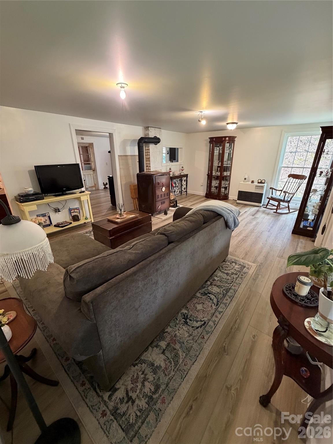658 Upper Hanging Rock Road Spruce Pine, NC 28777 - Photo 19 of 35 a living room with furniture and a flat screen tv