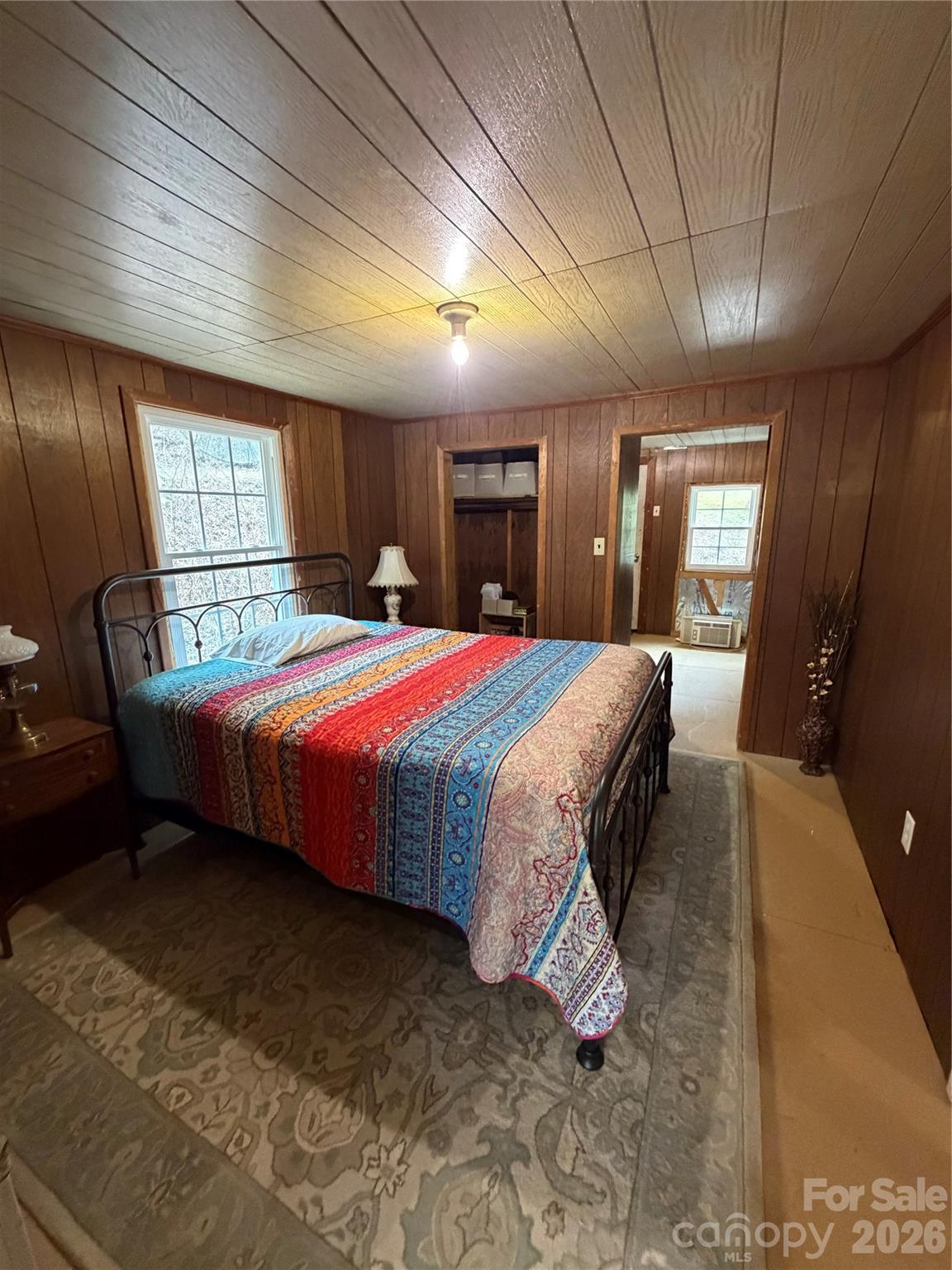 658 Upper Hanging Rock Road Spruce Pine, NC 28777 - Photo 20 of 35 a bedroom with a bed window and dresser