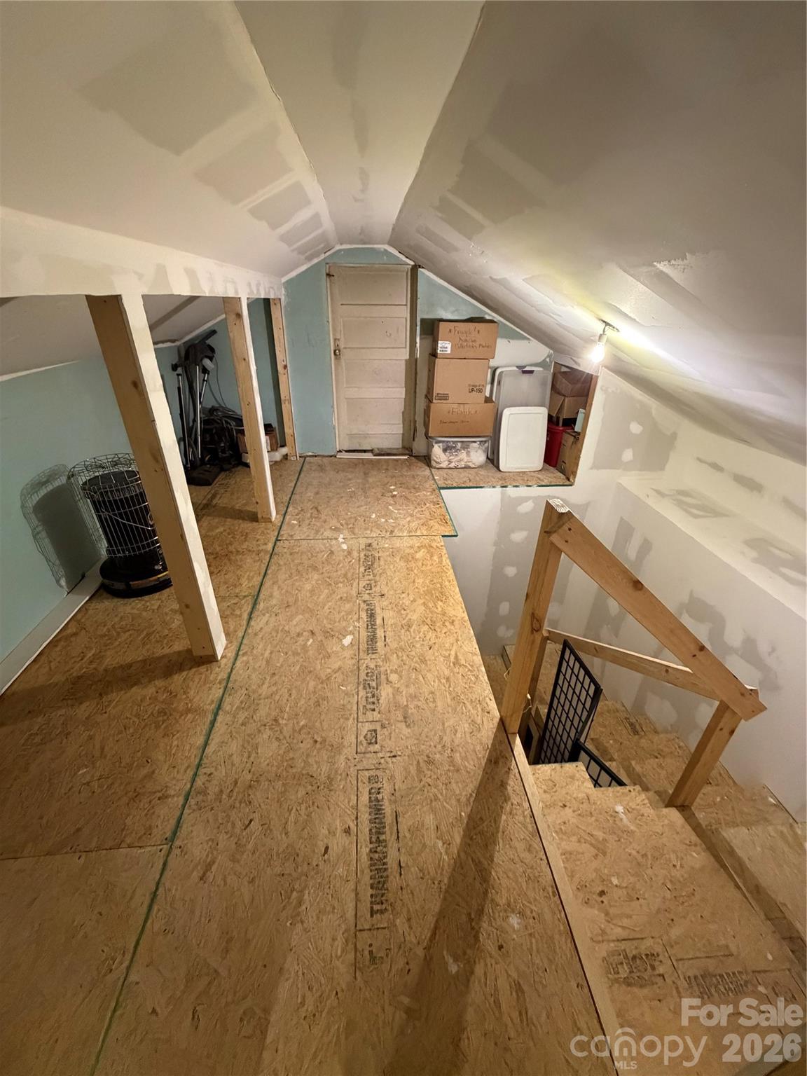 658 Upper Hanging Rock Road Spruce Pine, NC 28777 - Photo 24 of 35 a view of a livingroom with wooden floor