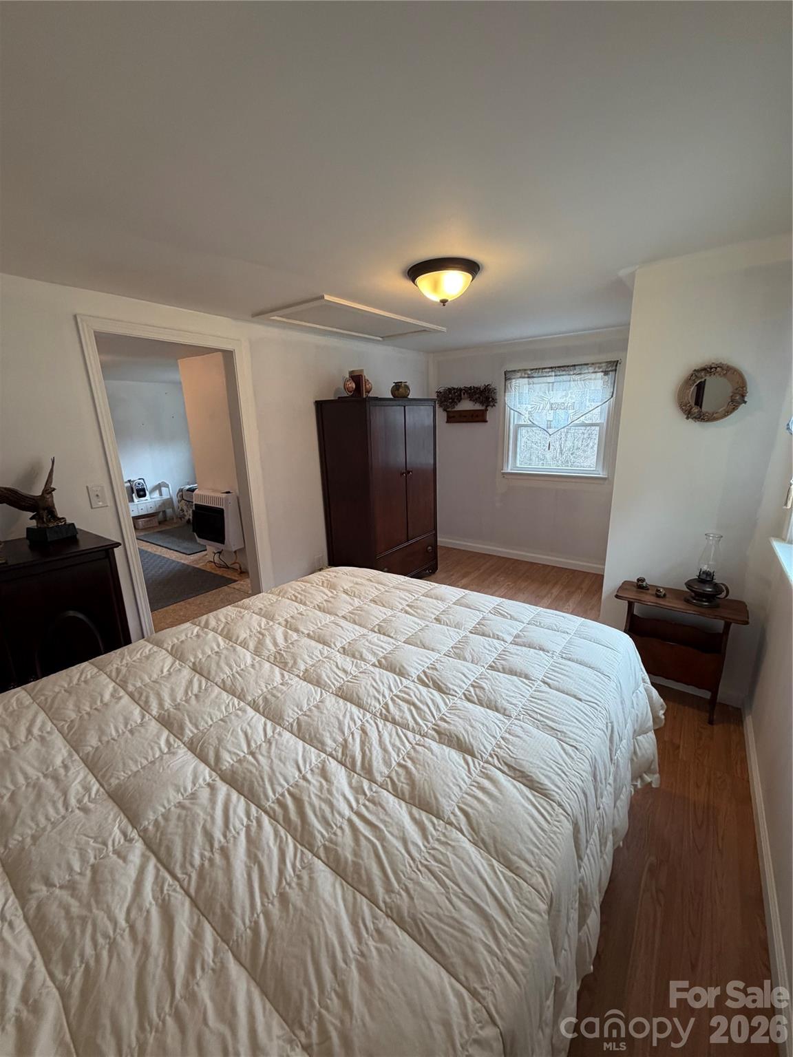 658 Upper Hanging Rock Road Spruce Pine, NC 28777 - Photo 28 of 35 a bedroom with a bed and a walk in closet
