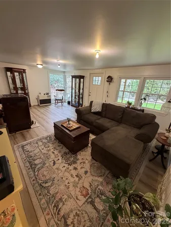 a living room with furniture and a rug