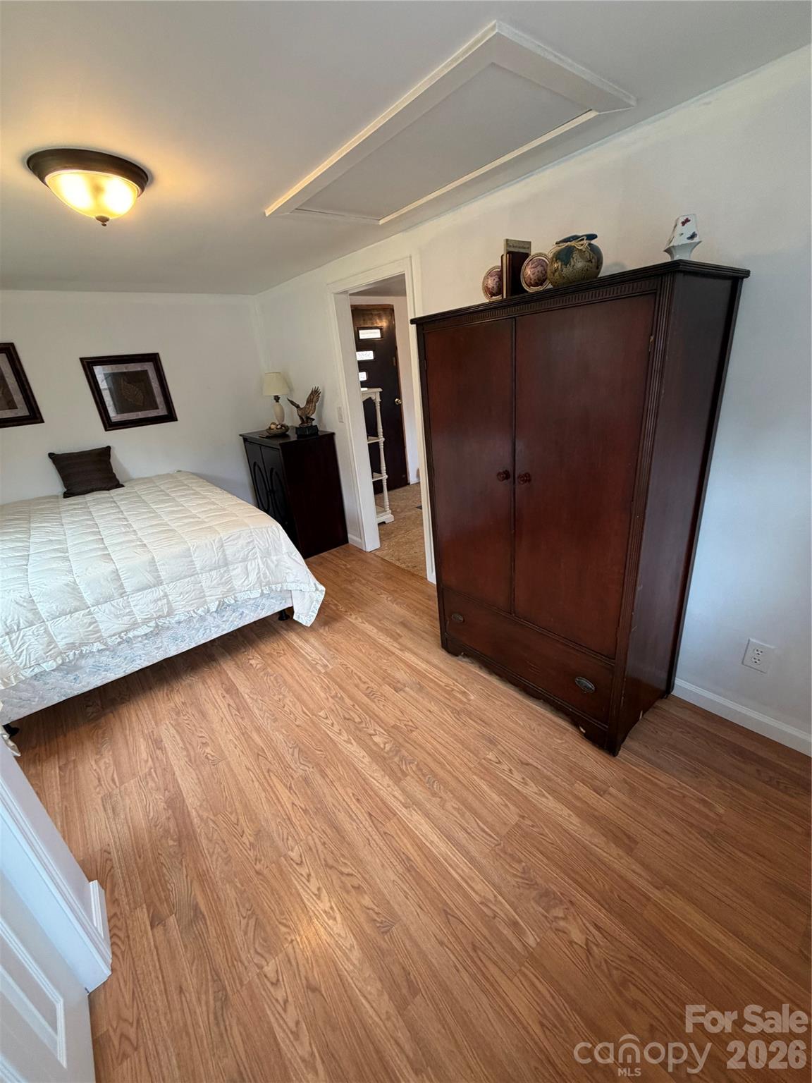 658 Upper Hanging Rock Road Spruce Pine, NC 28777 - Photo 32 of 35 a bedroom with a bed and a lamp