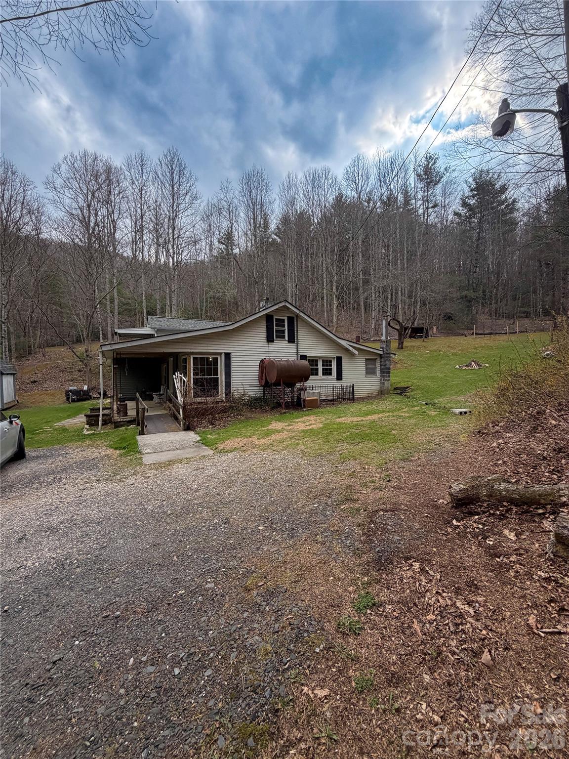 658 Upper Hanging Rock Road Spruce Pine, NC 28777 - Photo 33 of 35 a front view of a house with garden