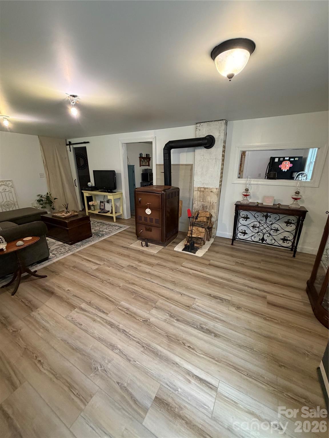 658 Upper Hanging Rock Road Spruce Pine, NC 28777 - Photo 4 of 35 a bedroom with furniture and a flat screen tv