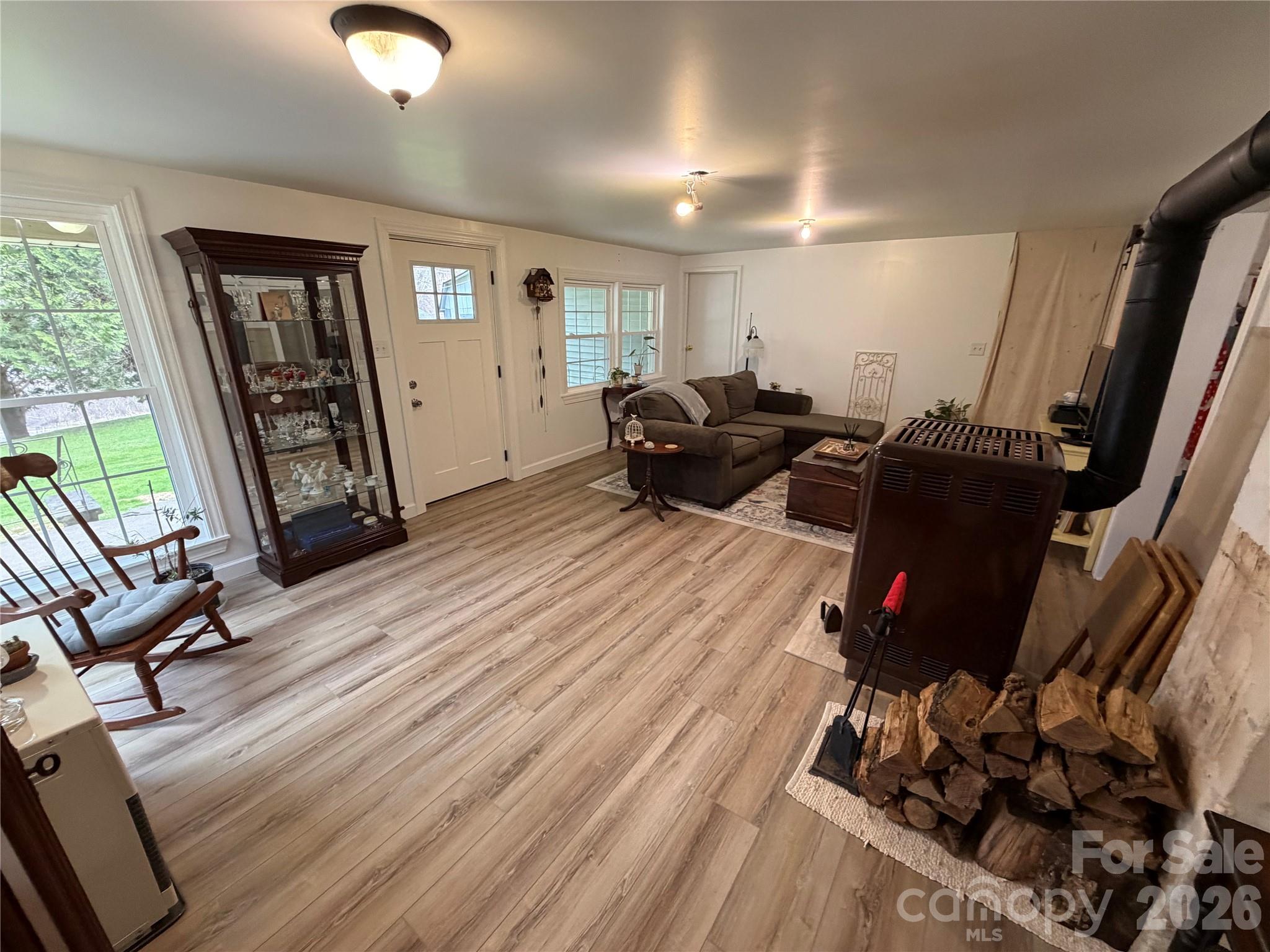 658 Upper Hanging Rock Road Spruce Pine, NC 28777 - Photo 5 of 35 a living room with furniture and a flat screen tv