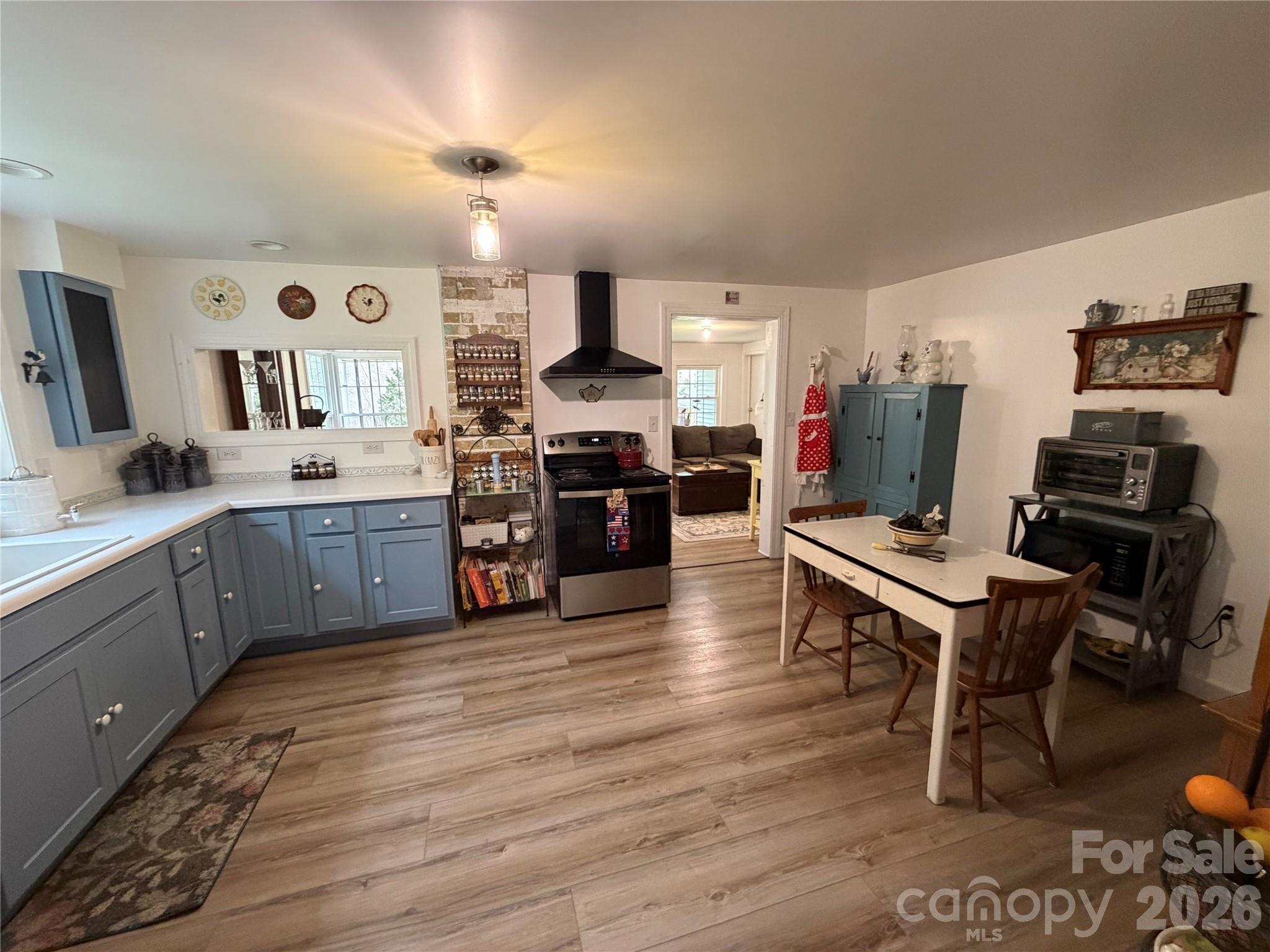 658 Upper Hanging Rock Road Spruce Pine, NC 28777 - Photo 7 of 35 a kitchen with stainless steel appliances a stove a sink dishwasher and a refrigerator