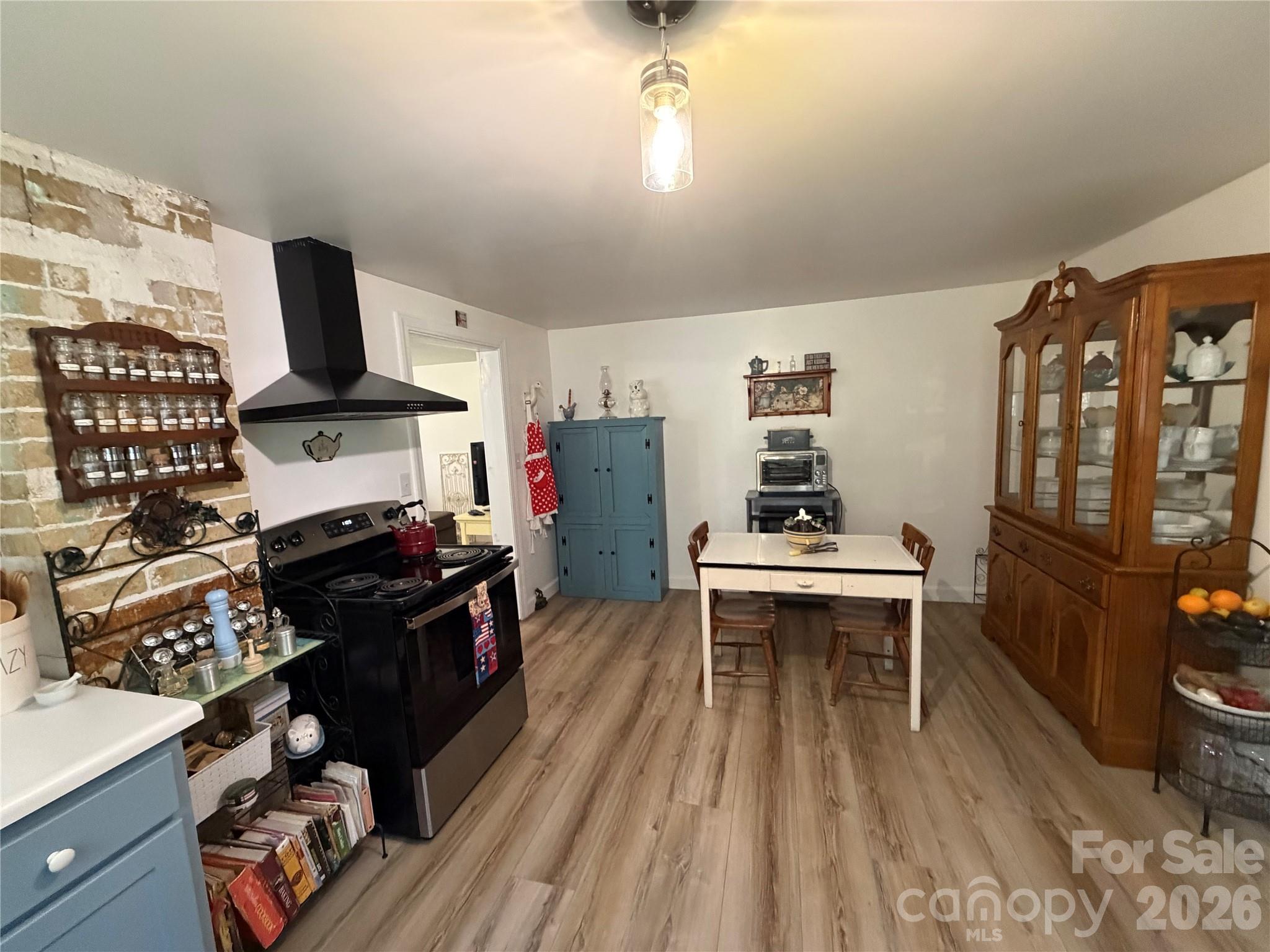 658 Upper Hanging Rock Road Spruce Pine, NC 28777 - Photo 10 of 35 a kitchen with a refrigerator and a stove
