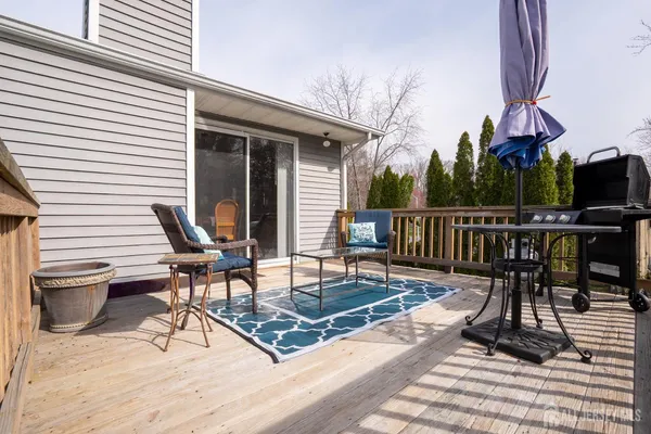 a view of a chairs and table on the deck