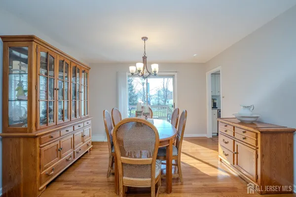 a living room with furniture a rug and a large window