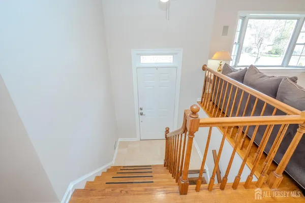 a kitchen with stainless steel appliances granite countertop a kitchen island hardwood floor sink and stove