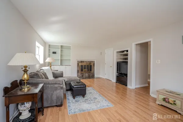 a bedroom with furniture and a window