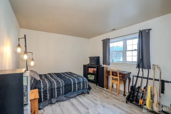 a white toilet sitting next to a bathroom sink and vanity