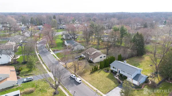 an aerial view of a house with a swimming pool