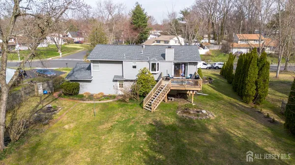 a view of a house with backyard porch and sitting area