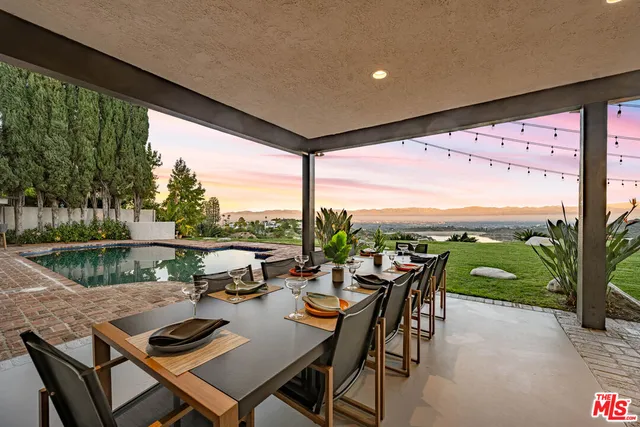 a front view of a house with swimming pool