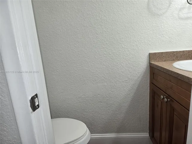 a bathroom with a sink and toilet
