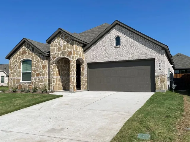 a front view of a house with yard