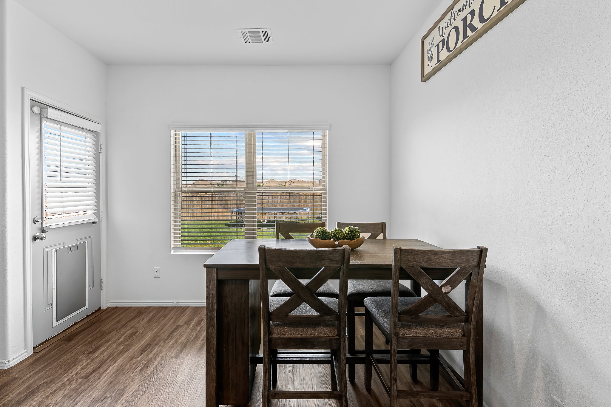 576 Greatest Gift Way Jarrell, TX 76537 - Photo 13 of 37 A casual dining space features a window overlooking the verdant backyard, perfect for intimate meals.