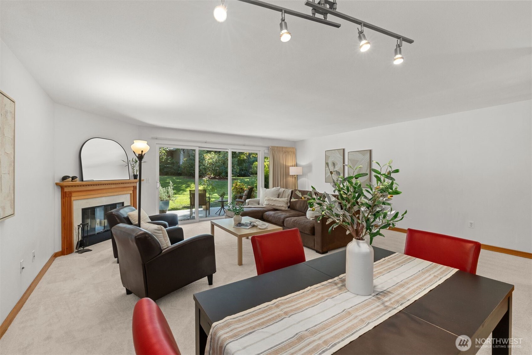 6423 Sand Point Way Northeast Seattle, WA 98115 - Photo 12 of 40 a living room with furniture potted plant and a large window