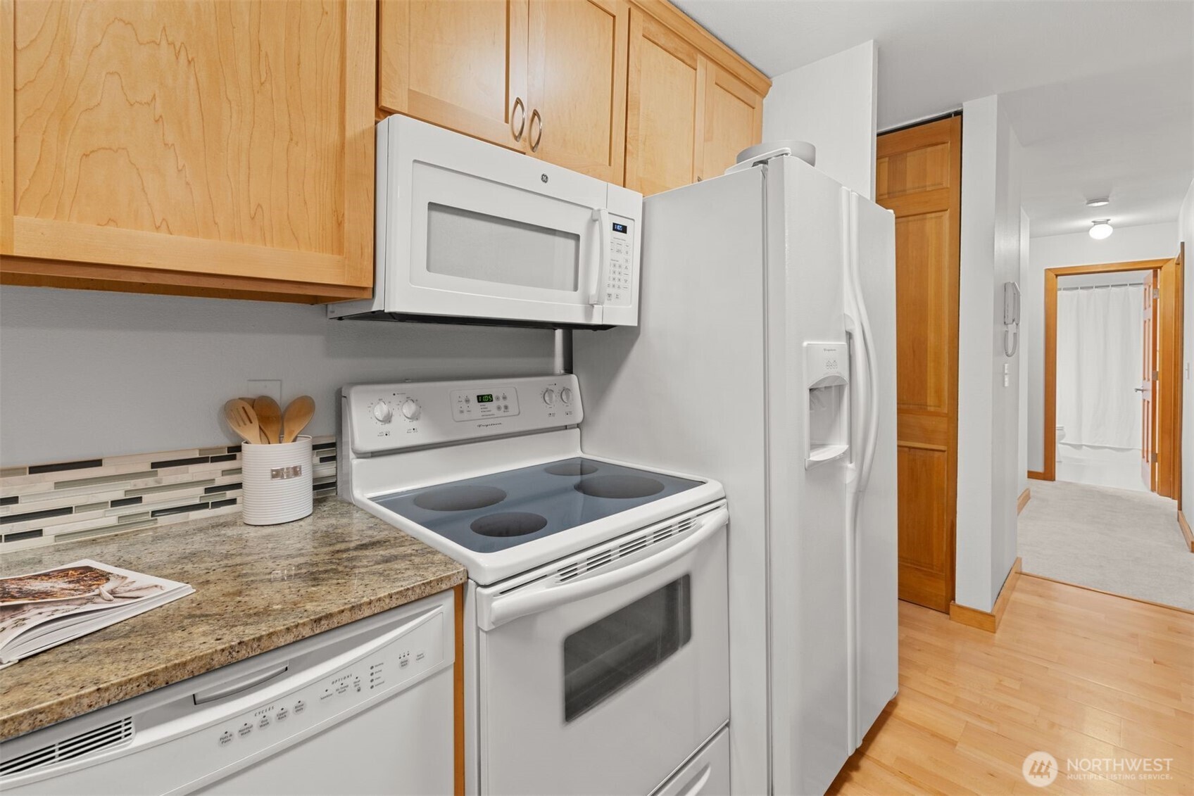 6423 Sand Point Way Northeast Seattle, WA 98115 - Photo 15 of 40 a kitchen with stainless steel appliances granite countertop a refrigerator sink and stove