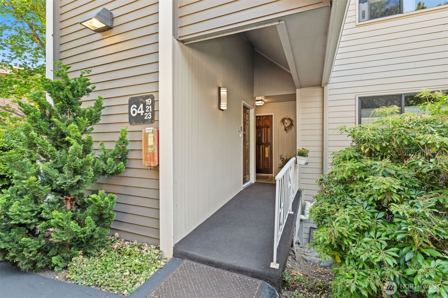 6423 Sand Point Way Northeast Seattle, WA 98115 - Photo 3 of 40 a view of a house with potted plants
