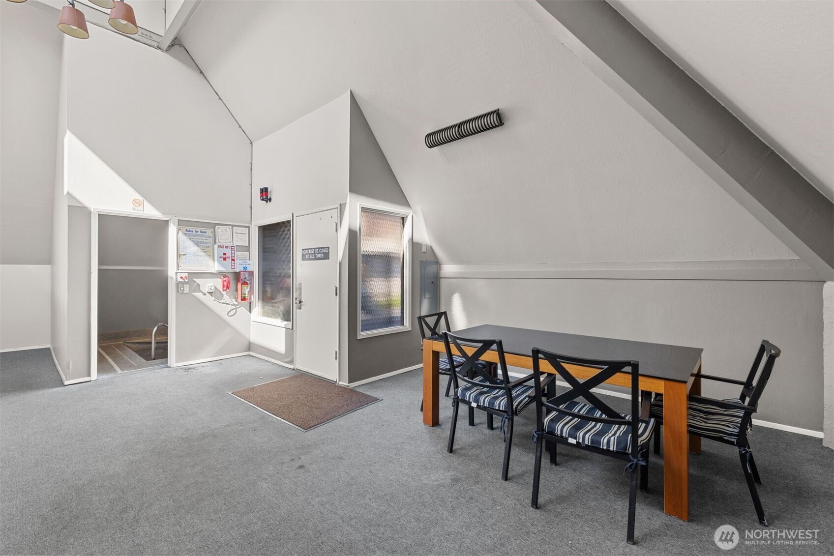 6423 Sand Point Way Northeast Seattle, WA 98115 - Photo 35 of 40 a view of a dining room with furniture and a table