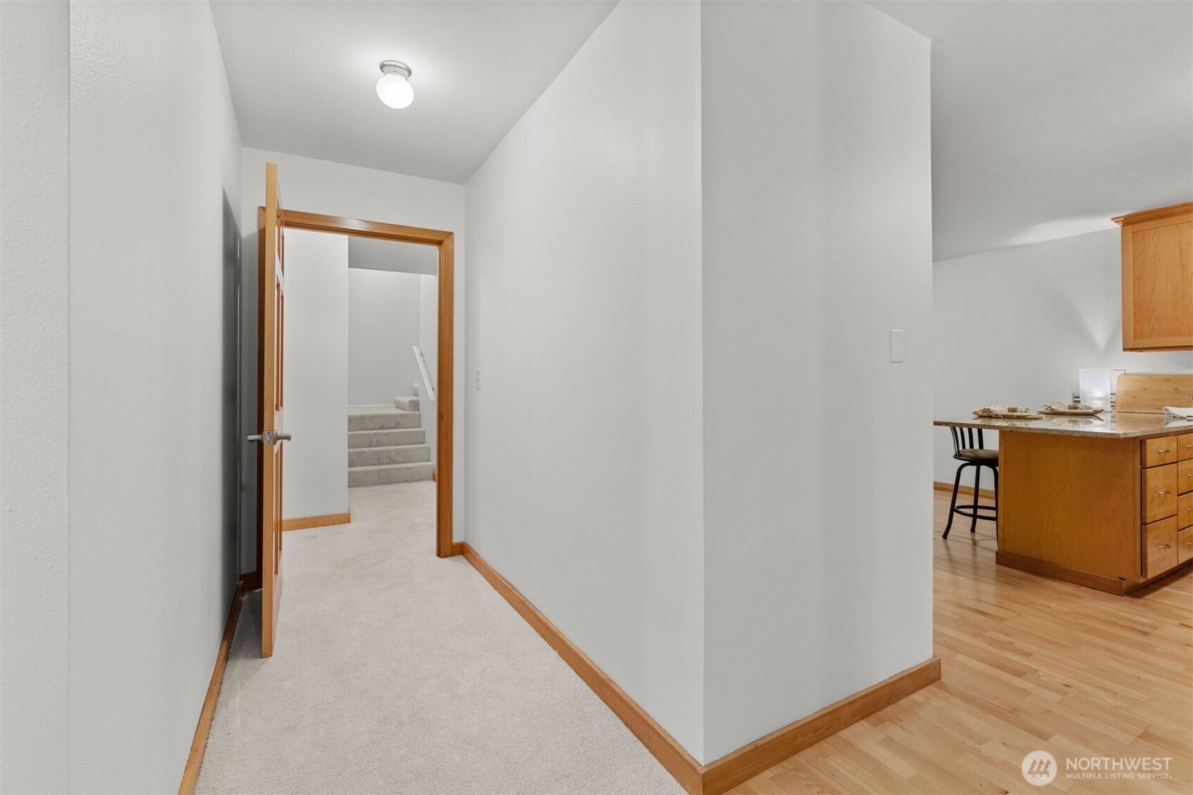 6423 Sand Point Way Northeast Seattle, WA 98115 - Photo 5 of 40 a view of a hallway with wooden floor