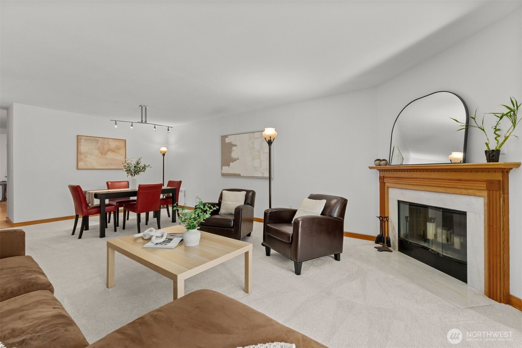 6423 Sand Point Way Northeast Seattle, WA 98115 - Photo 8 of 40 a living room with furniture a dining table and a fireplace