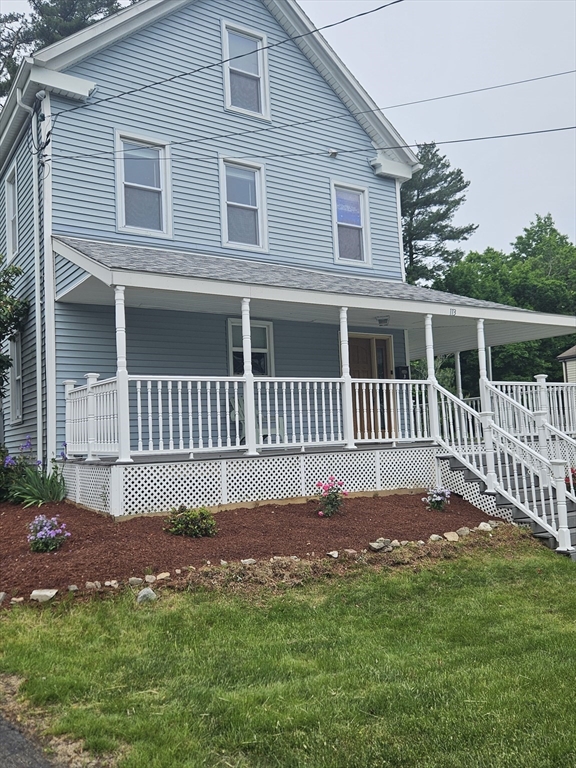 113 Rockland Street, Unit 2 Canton, MA 02021 - Photo 1 of 22 a front view of a house with a yard