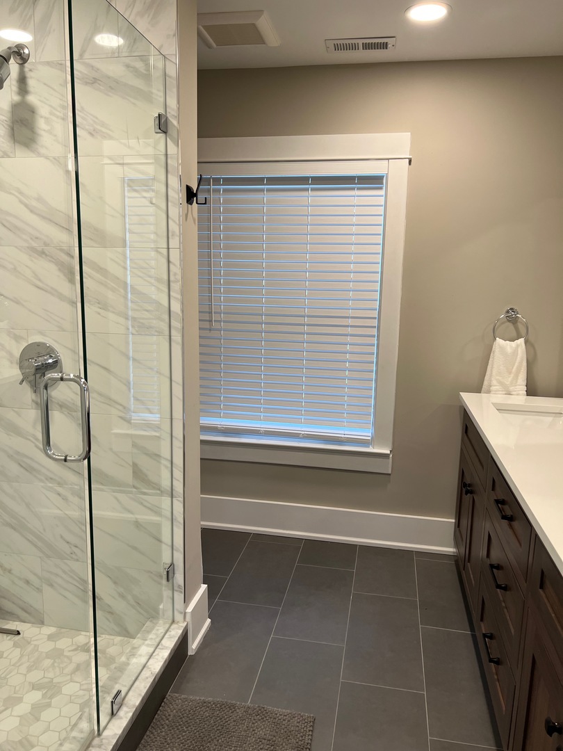 1100 Ridge Road Wilmette, IL 60091 - Photo 11 of 20 a bathroom with a granite countertop sink a toilet and shower