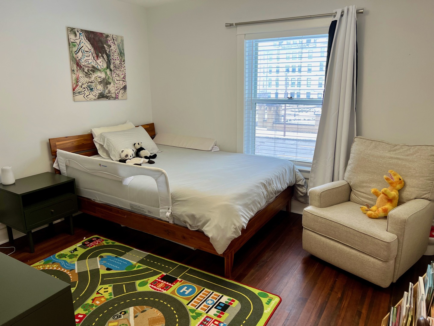 1100 Ridge Road Wilmette, IL 60091 - Photo 13 of 20 a bedroom with a bed and wooden floor